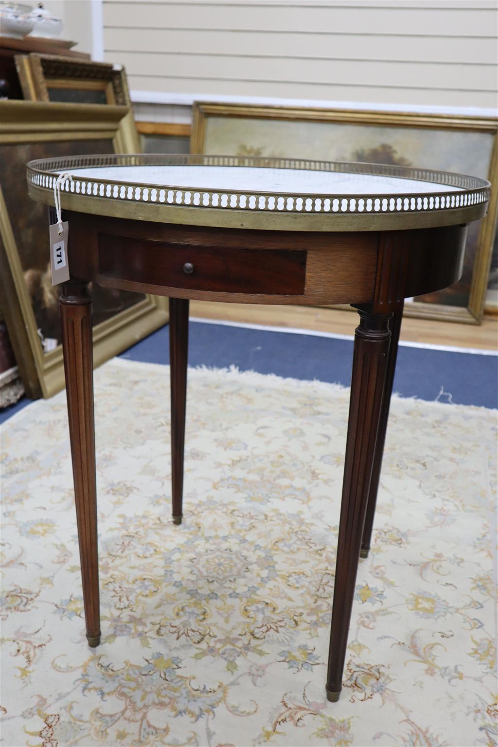 A pair of French style mahogany occasional tables with brass galleried marble tops, 65cm diameter, 75cm high